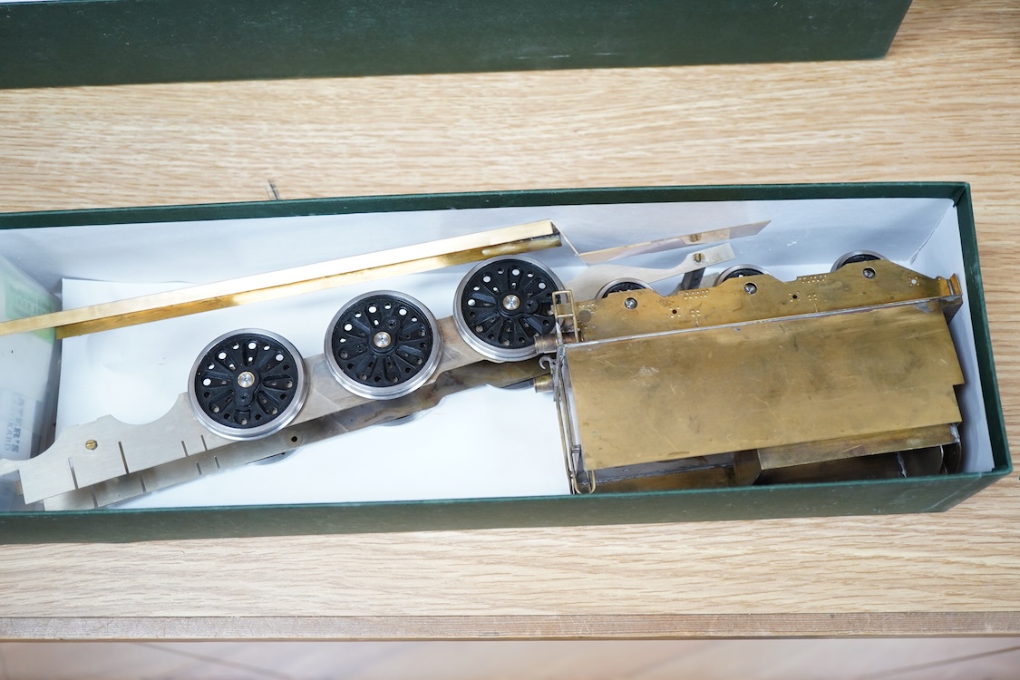 Eleven 0 gauge model railway items including; a bogie stake wagon, two mineral wagons, a North British coal wagon and two further open wagons, a partly constructed brake van, together with a Lima LMS 4F locomotive, two L